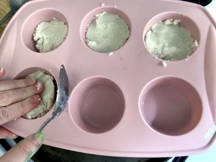 pressing sugar scrub into mould