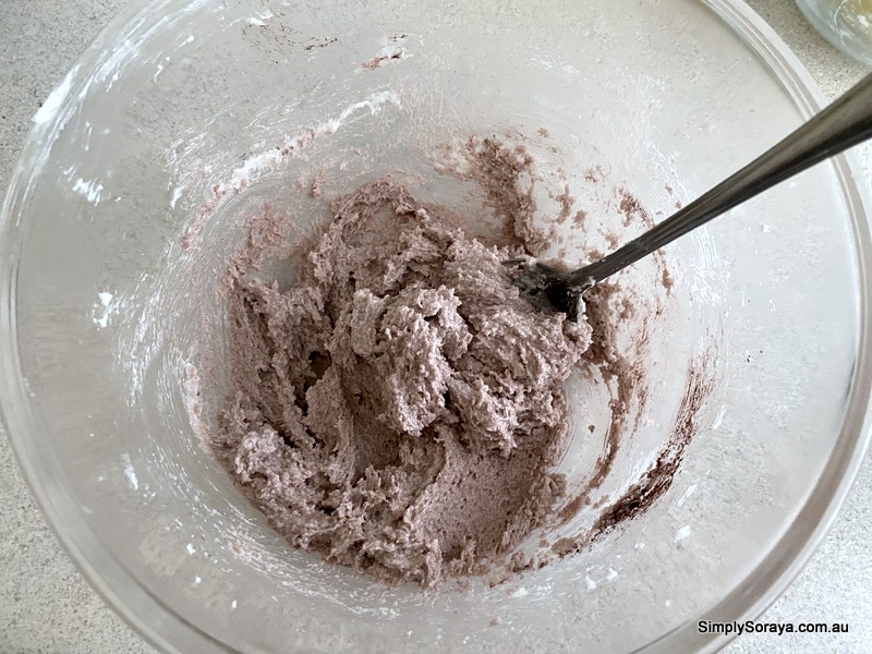 Mixing in the purple clay in sugar scrub