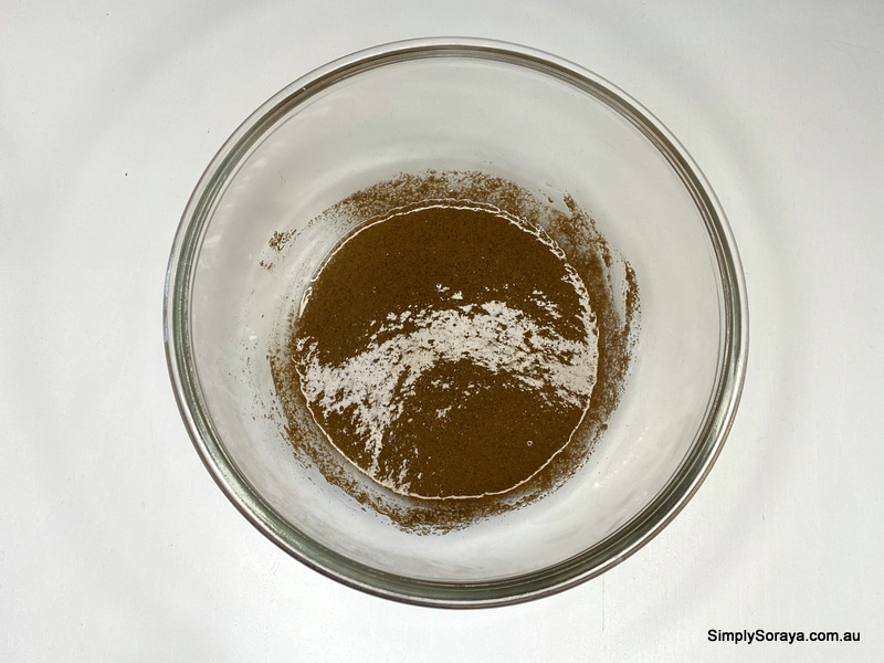 Mixing the ingredients together to make the sweet coffee scrub