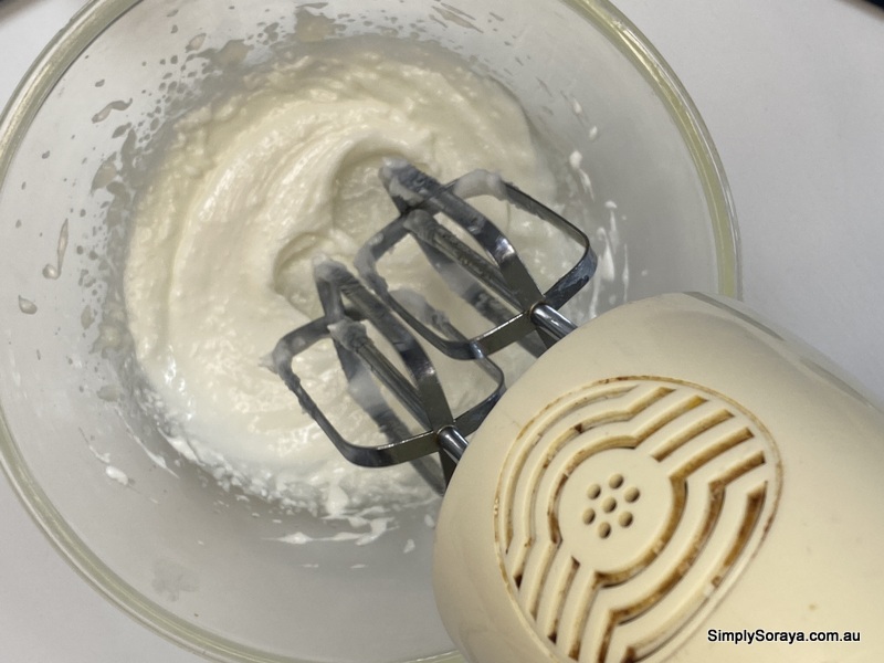 Whipping the mango butter and safflower oil