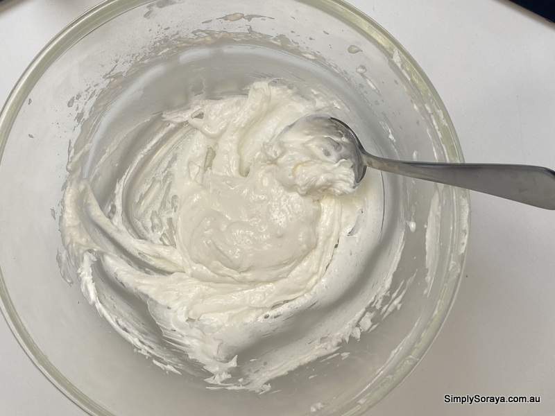 Mixing in the essential oils to perfect this mango butter body butter