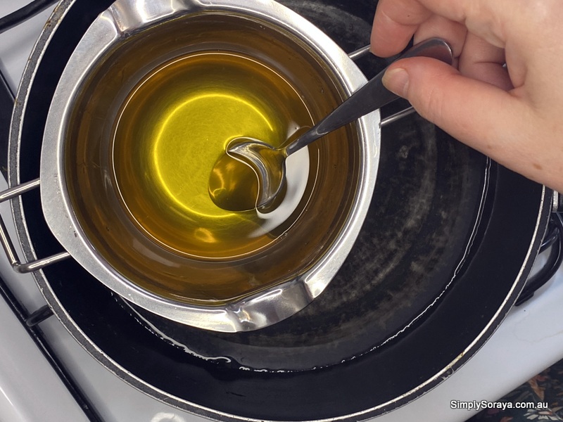 Melting and mixing the massage bar