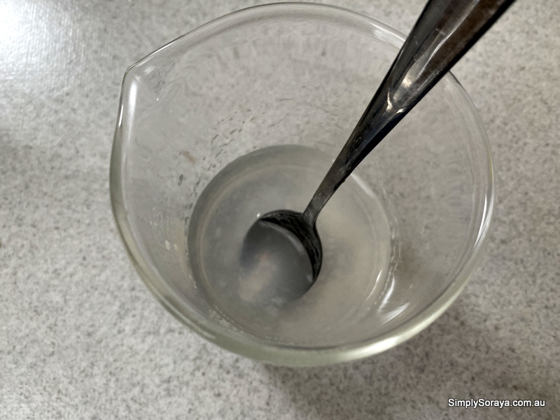 The water mixture before heating in a beaker