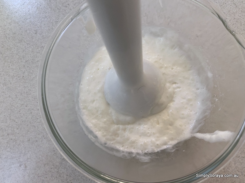 Blending the oil and water mixtures together to make hand lotion