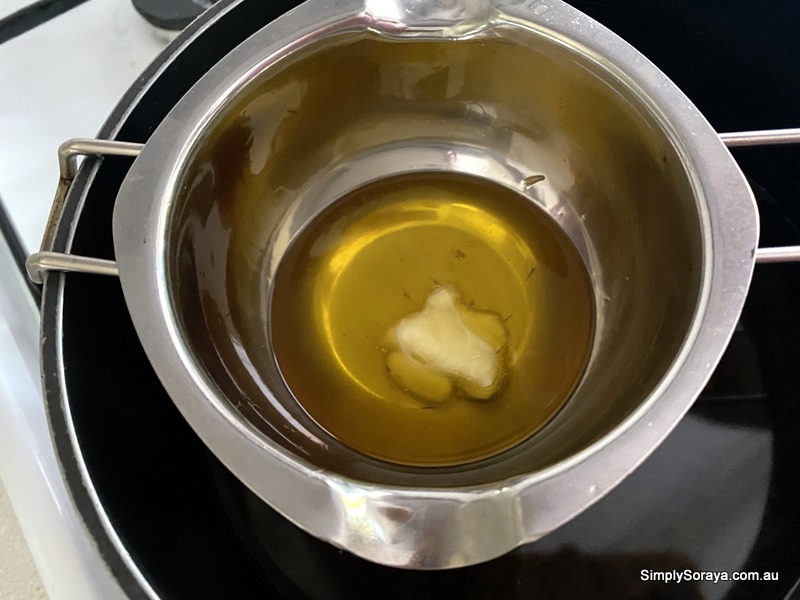 Melting the shea butter into the rest of the mixture